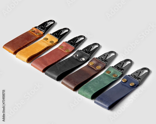 Handcrafted embossed leather keychains of various colors with carabiner clasps photo