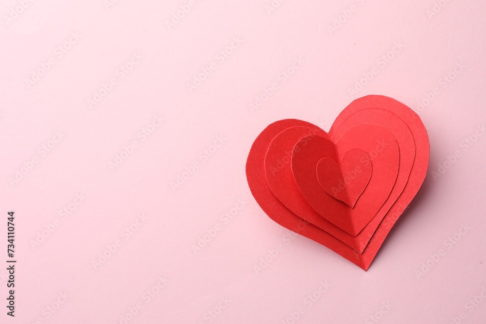 Paper hearts on pink background, top view. Space for text Paper hearts on pink background, top view. Space for text