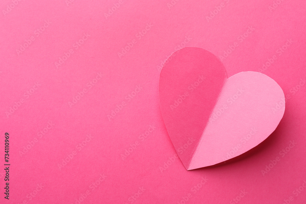 Paper heart on pink background, top view. Space for text