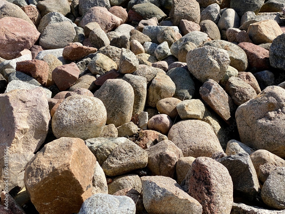 wet small stones lying on road in large reservoir wet small stones lying on road in large reservoir
