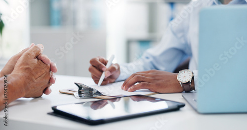 Man, hands and doctor consulting patient with clipboard, documents or insurance for healthcare at hospital. Closeup of male person or medical employee in consultation, advice or help at clinic desk photo