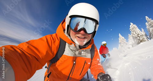 Skier taking a selfie on a ski slope in the mountains.