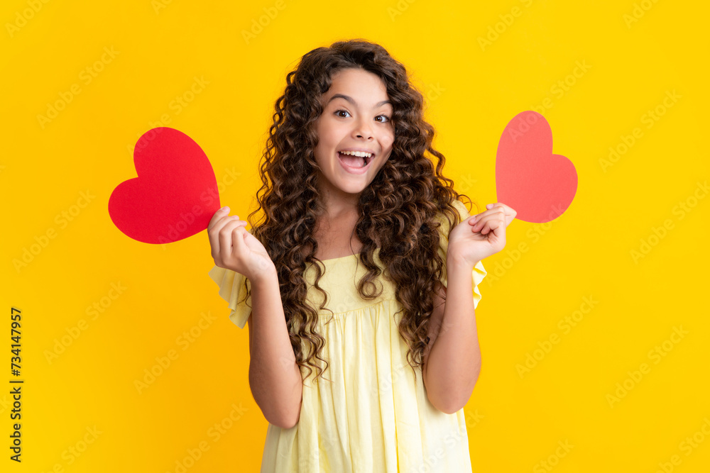 Valentines Day. Dreaming cute teen child with red heart. Excited teenager, glad amazed and overjoyed emotions. Valentines Day. Dreaming cute teen child with red heart. Excited teenager, glad amazed and overjoyed emotions.