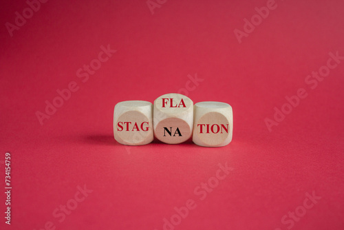 Принти на полотні Turned wooden cubes, changes the red word stagnation to stagflation