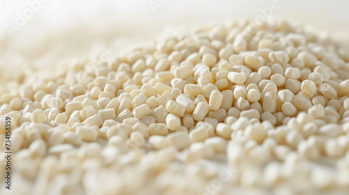 Close Up View Of White Polyester Grains Against A White Background. Industrial Raw Material for Plastics Manufacturing