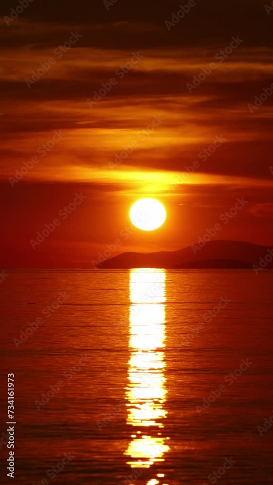 the sun is sinking into the sea. possible to accelerate the image stream. Vertical video for social media. the sun is sinking into the sea. possible to accelerate the image stream. Vertical video for social media.
