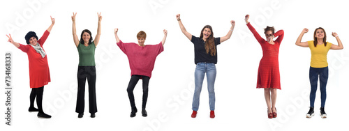 group of happy women raising arms on white background