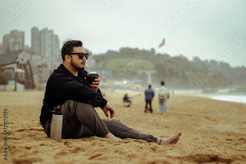 Shoreline Serenity: Mate and Sunglasses by the Sea #734173596