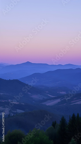 Sunset in the mountains, landscape at twilight with layers of hills and a gradient sky from blue to pink hues © Nadya