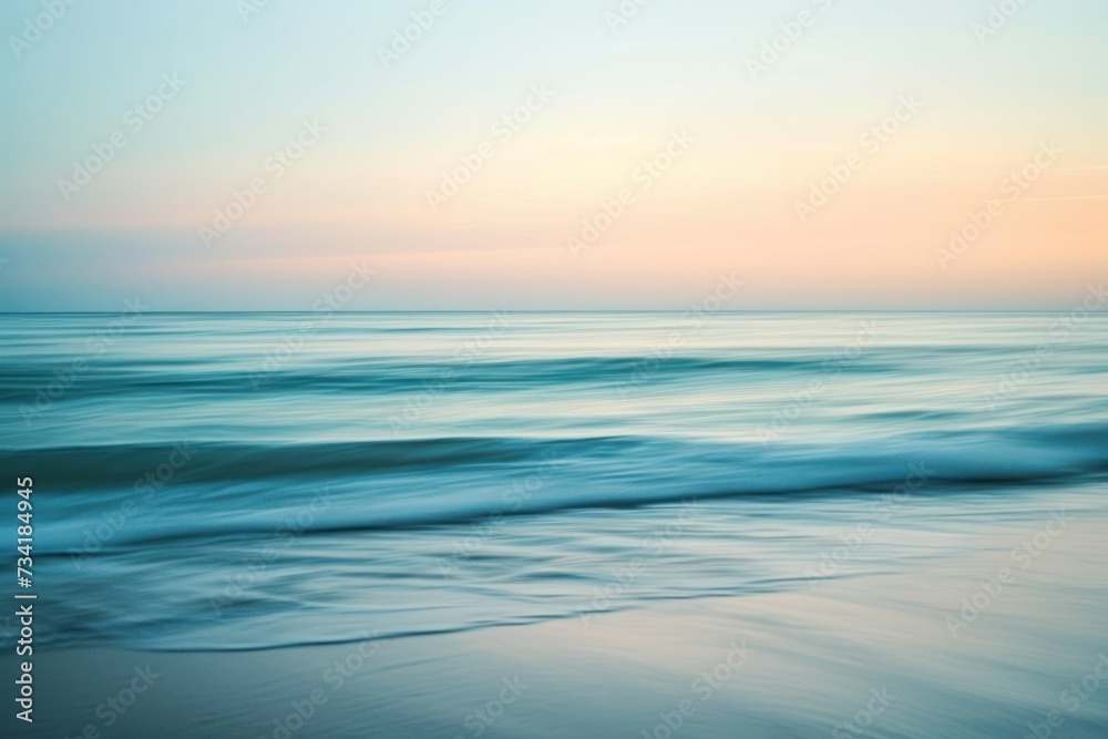 Serene ocean waves captured at sunset under a gradient sky