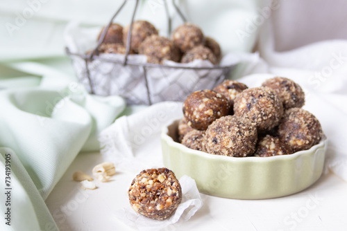 healthy food, delicious energy balls in a basket, light background, protein ball, rich in protein, vegan, natural snack, juicy, nuts, diet, green, plant-based, hazelnut, almond, close up, fitness