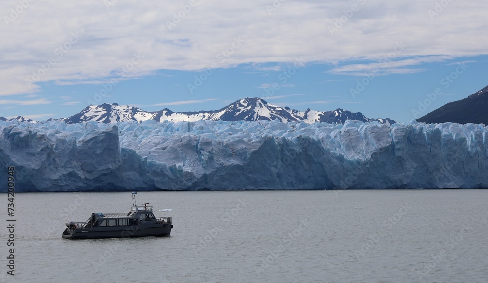 Sky, mountains, glacier and boat