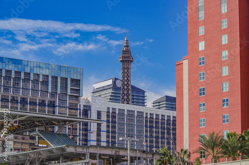 Neon signs, glitz casino hotel resorts, traffic and highrise city skyline in superlative gambling wedding party destination Las Vegas, Nevada with strip traffic street scene and modern architecture