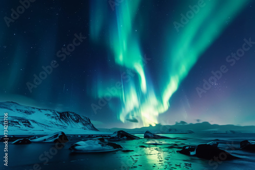 Northern lights in night sky over snowy mountains, Aurora Borealis over sea landscape, Beautiful Polar lights © Lazy_Bear