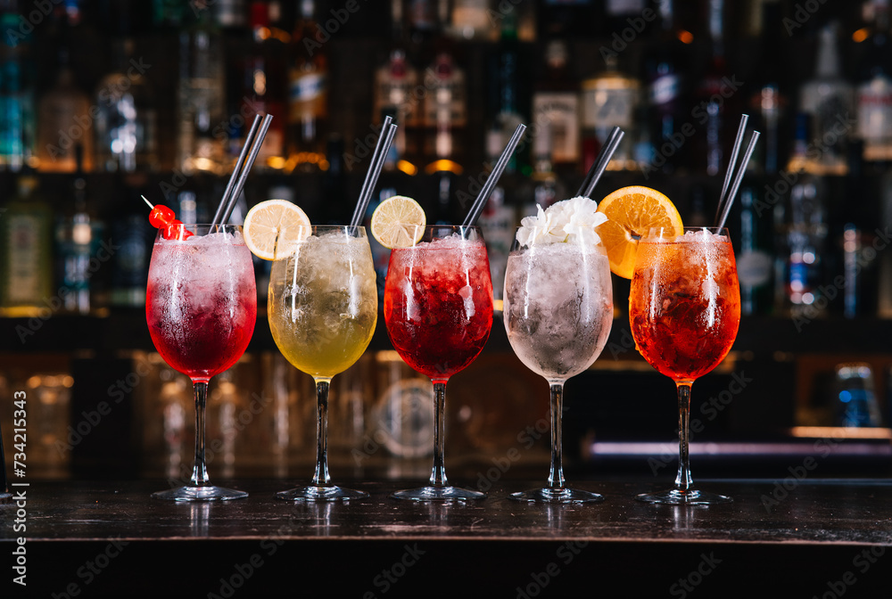 Mix of colourful cocktails on a bar