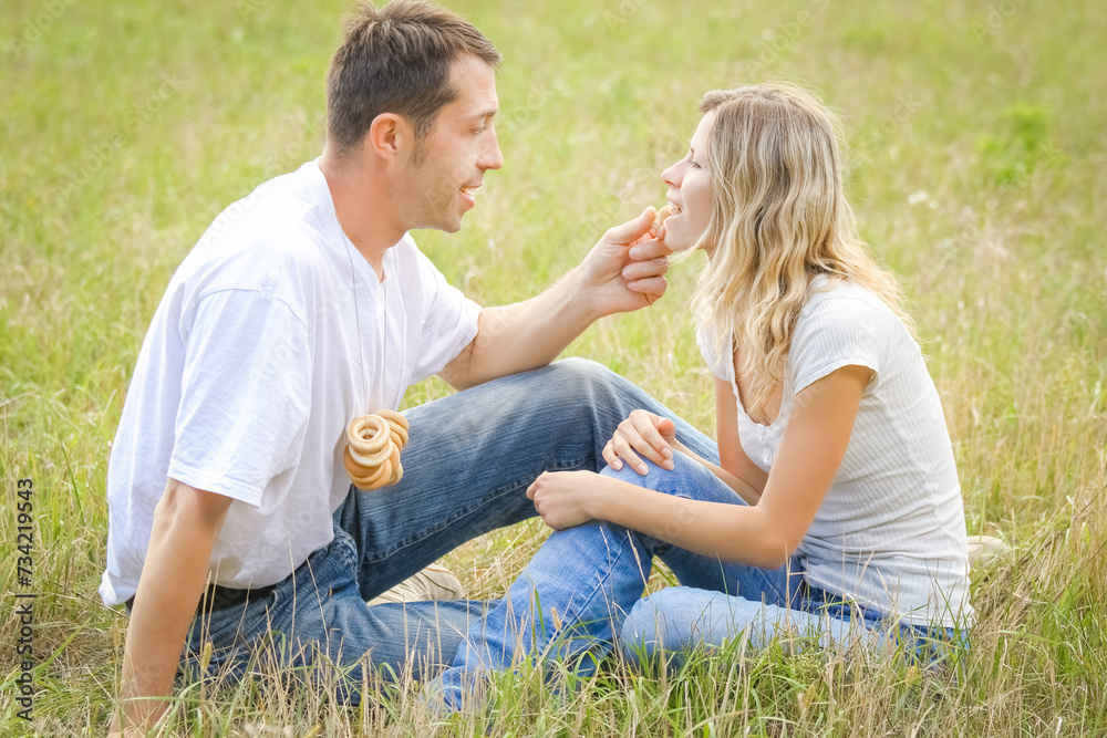 Fototapeta premium happy couple in love outdoors in the summer park