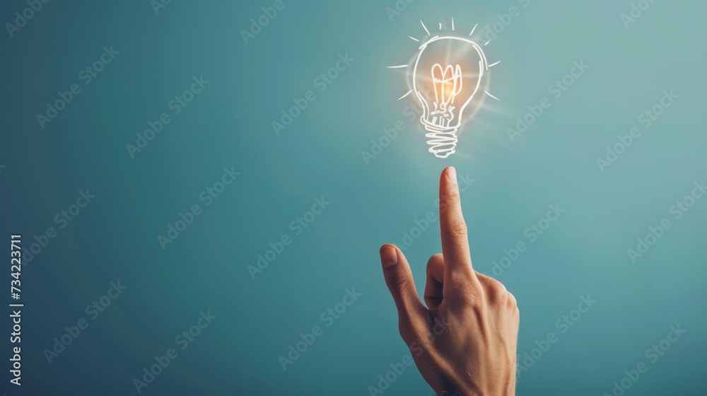 © Studio Nova - A hand touching a drawn lightbulb symbolizing an idea on a teal background. © Studio Nova - A hand touching a drawn lightbulb symbolizing an idea on a teal background.