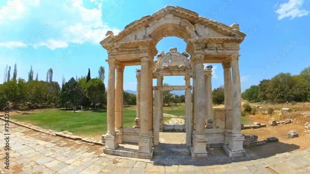 Aerial HYPER-LAPSE view of the ancient monumental gateway or tetrapylon, in Aphrodisias UNESCO archaeological site. Ancient Greek Hellenistic city dedicated to the goddess Aphrodite. UNESCO site. Aerial HYPER-LAPSE view of the ancient monumental gateway or tetrapylon, in Aphrodisias UNESCO archaeological site. Ancient Greek Hellenistic city dedicated to the goddess Aphrodite. UNESCO site.