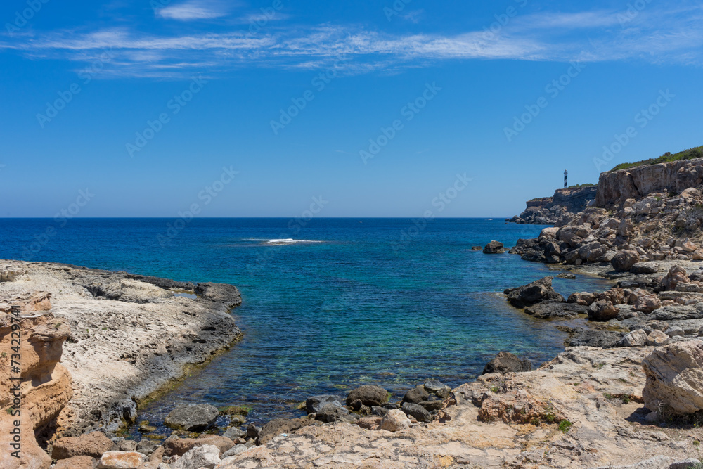 Rocky Mediterranean bay on the island of Ibiza.Tourist destination. Holiday. Vacation. Rocky Mediterranean bay on the island of Ibiza.Tourist destination. Holiday. Vacation.