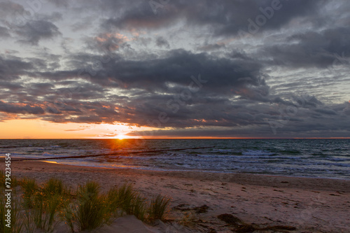 dramatic sunset with interesting clouds on the beach of the Baltic Sea  interesting colors and cloud structures