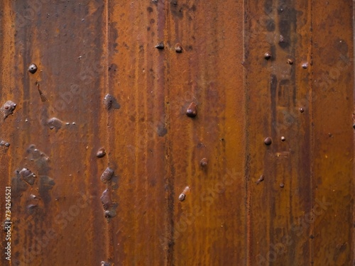Rust texture on a metal surface with visible detachments and oxides.