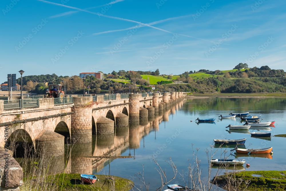 Stone bridge near the town of San Vicente de la Barquera, tourist area in northern Spain.