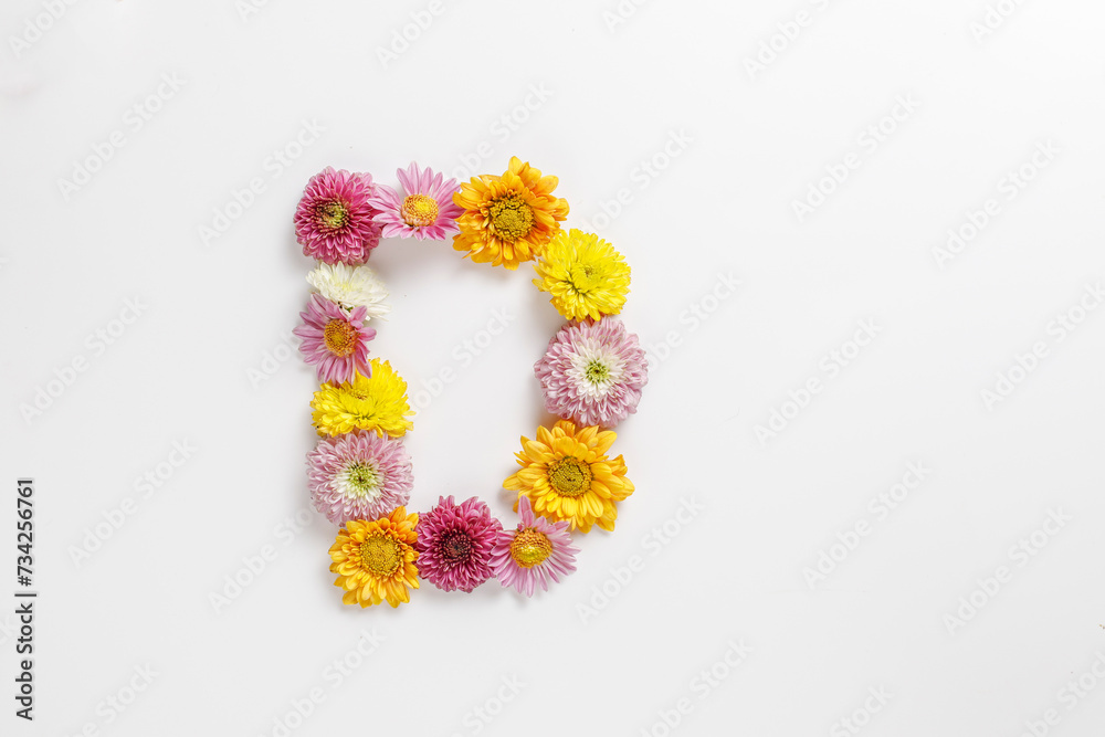 Letter D made of real natural flowers.