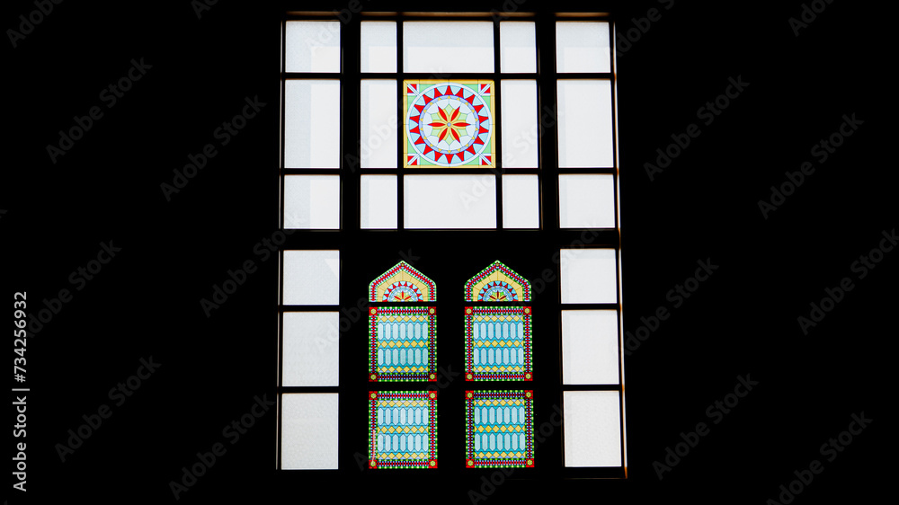 Sun light coming through the colorful stained glass window of a mosque. Sun light coming through the colorful stained glass window of a mosque.