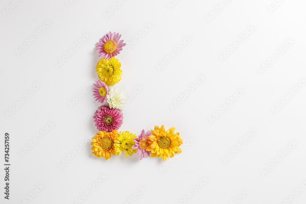 Letter L made of real natural flowers.