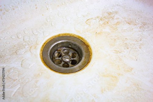 Фотография Dirty dishwasher, dirty sink drain.