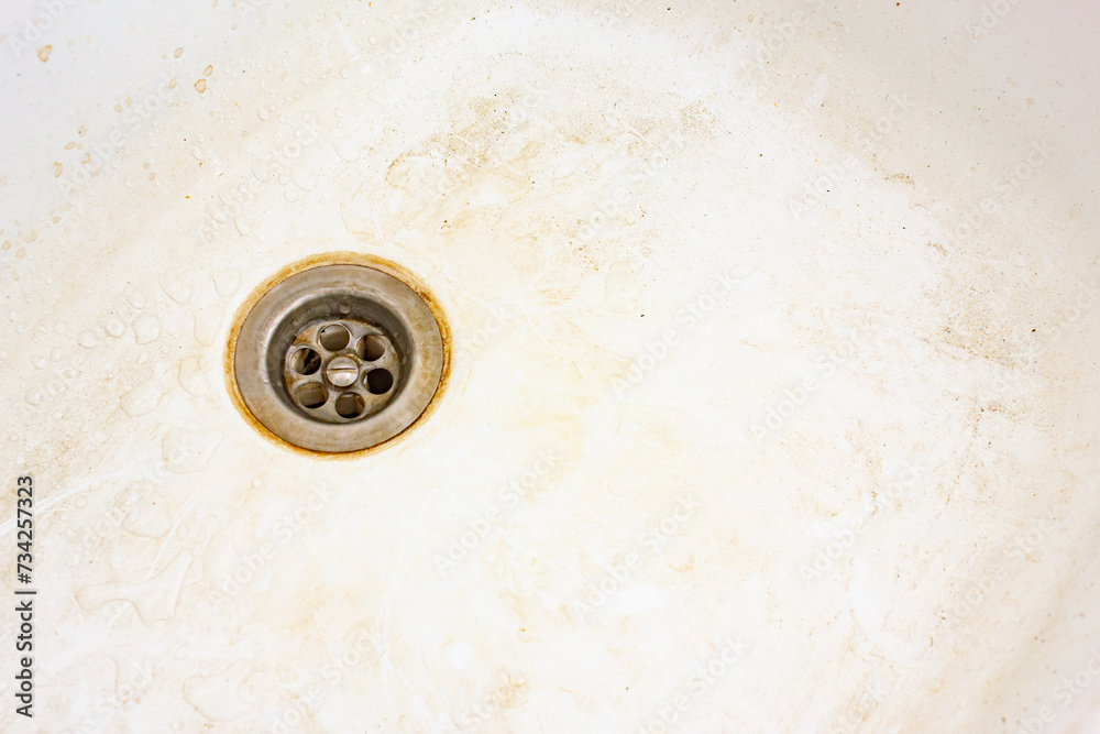 Dirty sink surface, dirty dishwasher with stains and grease. Dirty sink surface, dirty dishwasher with stains and grease.