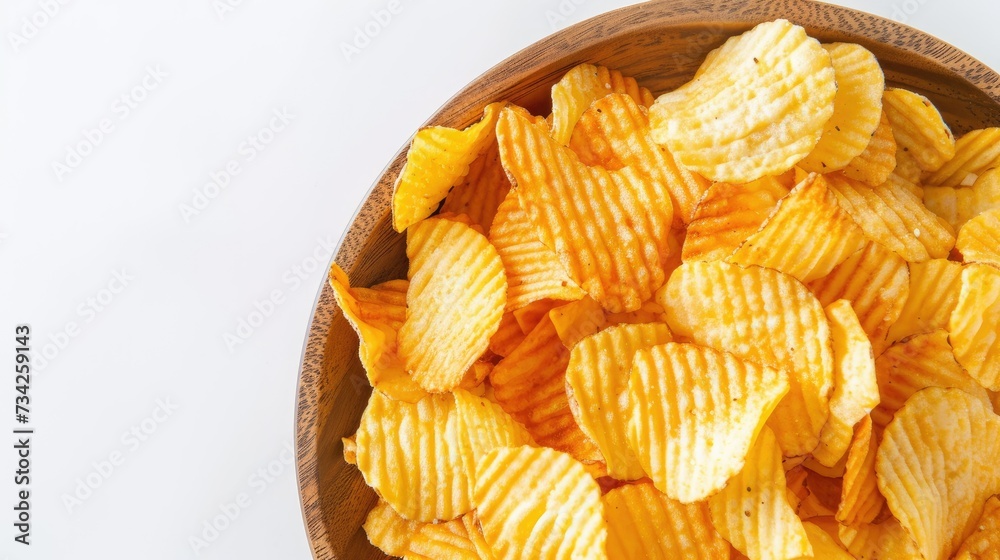 Crisp Golden Potato Chips: Close-up of a bowl full of crisp golden potato chips, snack time indulgence Crisp Golden Potato Chips: Close-up of a bowl full of crisp golden potato chips, snack time indulgence