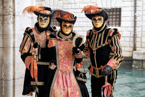 Venice, Italy - February 2022 - carnival masks are photographed with tourists in San Marco square © Renato68