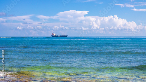 Ship at sea in the Caribbean heading to the Atlantic ocean Pacific ocean sailing in the pristine turquoise blue green water