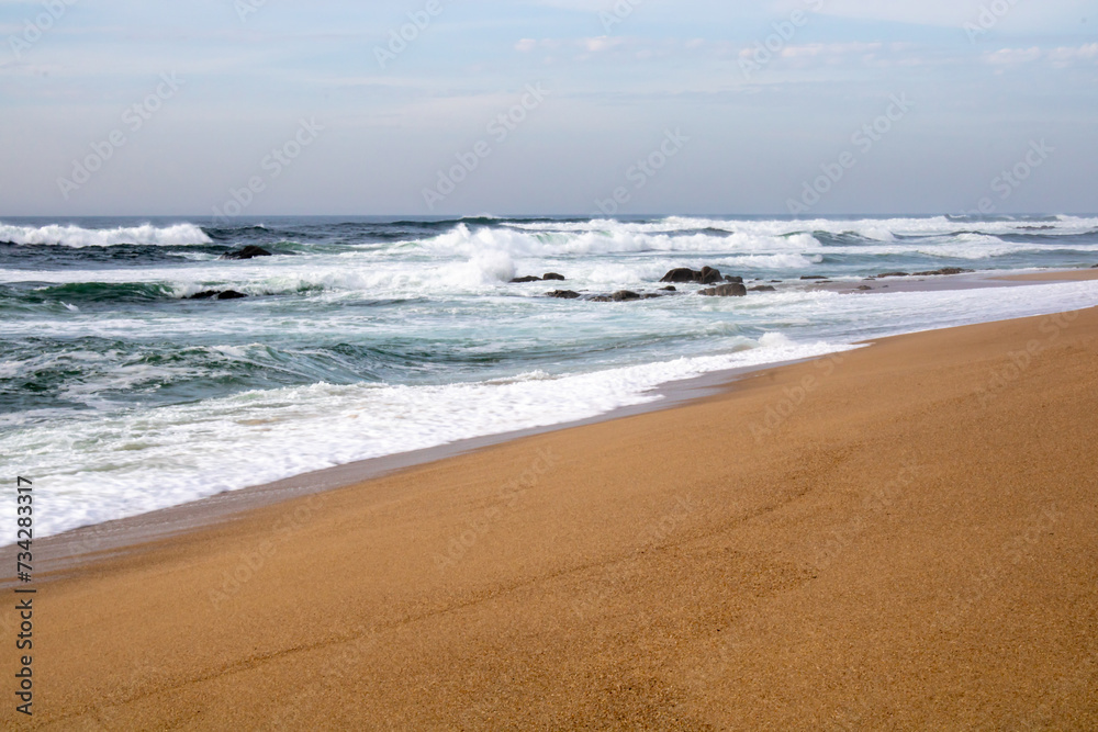 waves on the beach, sand with blue sky waves on the beach, sand with blue sky