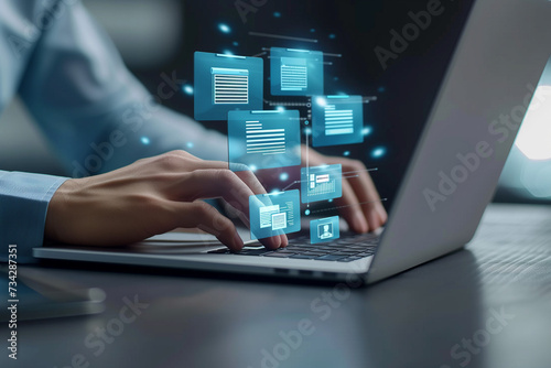 Corporate data management system concept. Businessman use laptop with virtual screen of Documents icon for document secure confidential access. Personal data and corporate personal data protection.