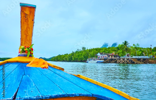 Ao Phang Nga National Park coast behind the longtail boat, Thailand photo