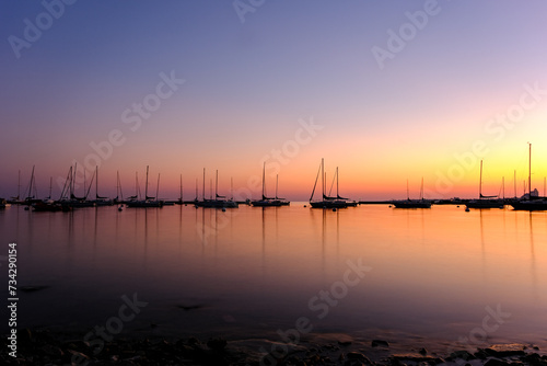 Sunset at the marina harbor with many boats © Serg