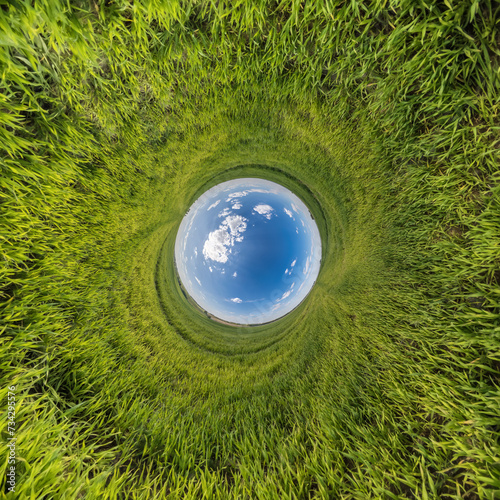 blue hole sphere little planet inside green grass round frame background