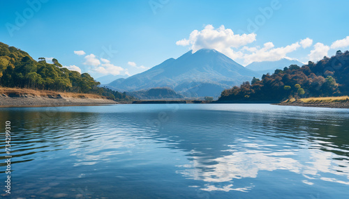 Majestic mountain peak reflects in tranquil blue pond, nature beauty generated by AI