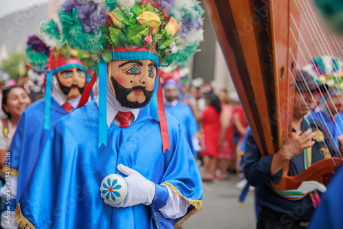 Dancers of the Ancash region with their typical costumes in the parade in the historical center of Lima, Peru. photo