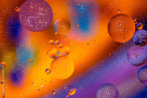 Colorful artistic of oil drop floating on the water. Abstract colors water bubbles background. holiday light background. oil drops on the water surface