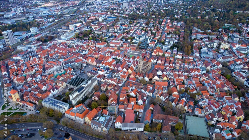 Aerial around the old town of the city Reutlingen in Germany on a sunny afternoon in autumn	
