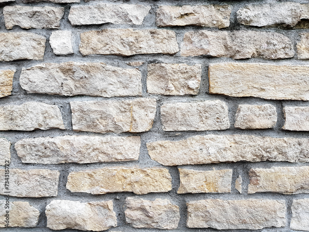 Obraz premium Old bright white pattern stone wall texture.