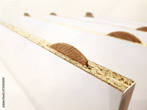 Biscuit joiner as a method of joining furniture boards.