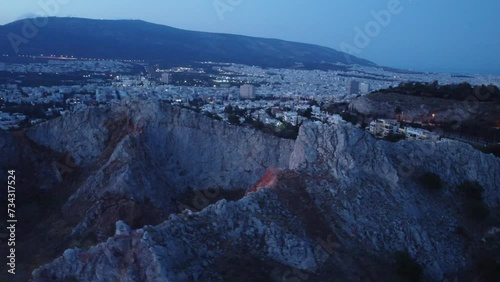 This footage is made with a drone, from the neighbourhood called Galatsi, also known as Tourkovounia, a small hill in the center of Athens. This footage is made early in the morning, at winter photo