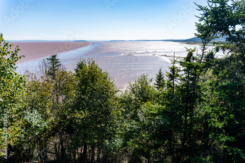 Hopewell's mud flats, coastline of Bay of Fundy. The Daniel’s Flats, northwestern side of Chignecto Bay (“north fork” of the upper Bay of Fundy), New Brunswick, Canada. Low Tide.  photo