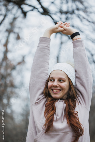Woman With Braces Raising Arms