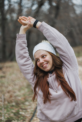Woman Wearing Hoodie Stretching Her Arms