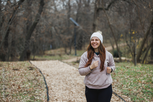 Woman Running in the Park With a Hat On